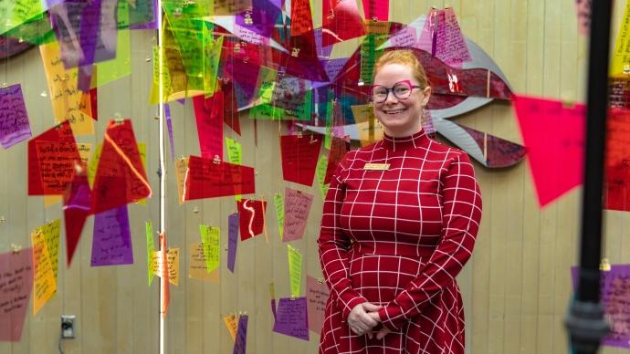 Jeanna Balreira stands in front of art installation